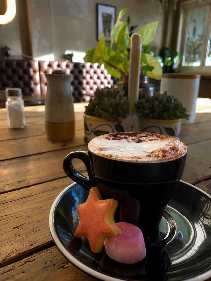Coffee and biscuits on a table at Me & You Cafe